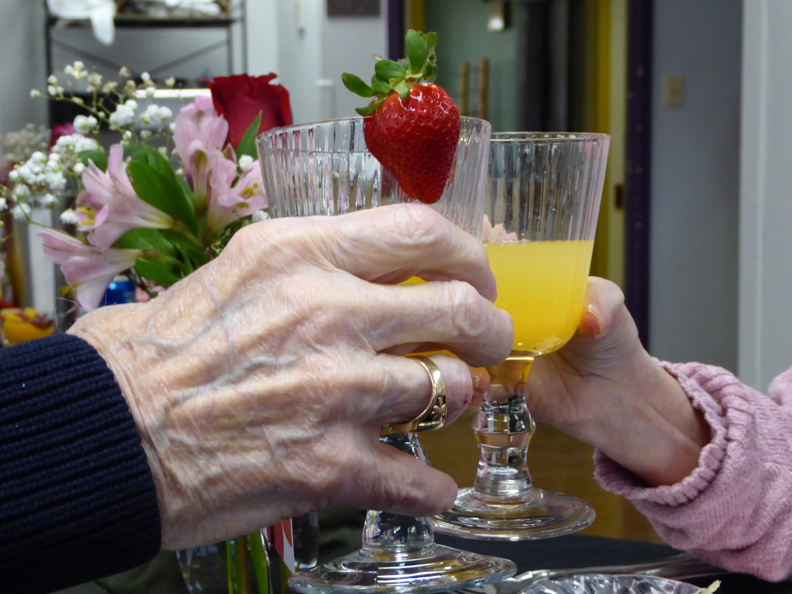 two residents at St. Patrick's Residence enjoy a toast.